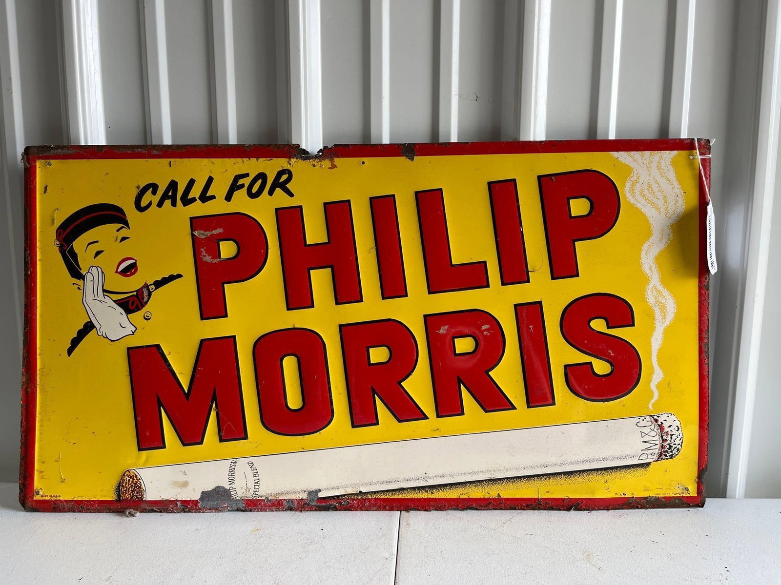 Phillips Morse SST Sign: Stout Sign Co. Shows wear and rusting along all edges. 27 x 14.5