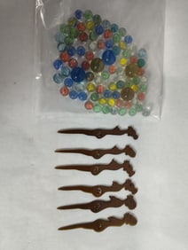 Evaluation of a Woman Stir Sticks & Glass Marbles