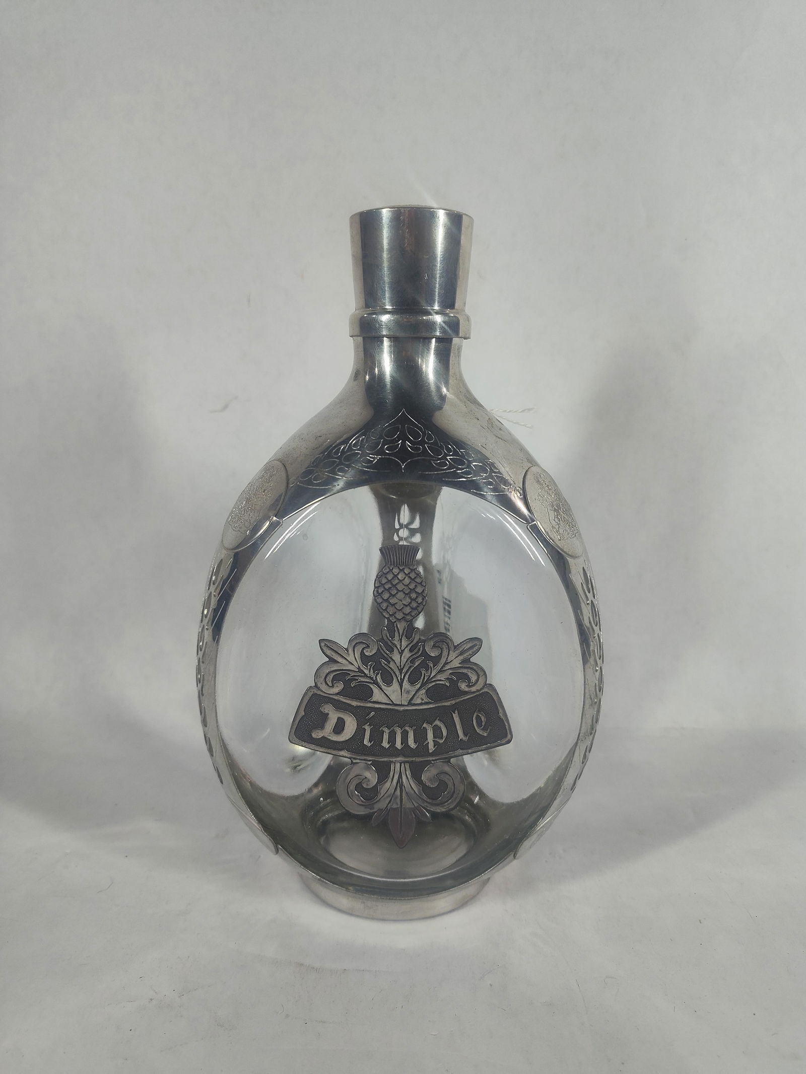 Royal Haig Dimple Whisky Decanter: Pewter encased glass bottle. 8.5 inches tall