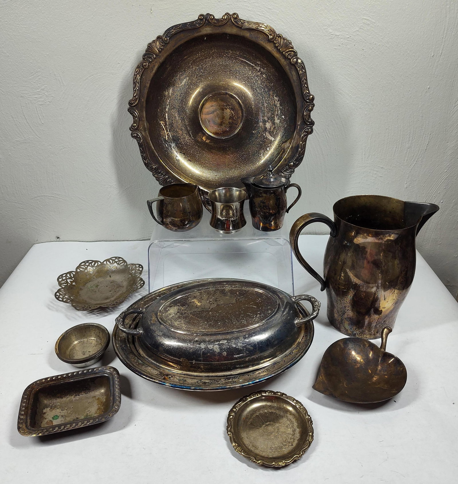 Silver Plated Serving Ware: Most is tarnished, includes larger platters, and dishes