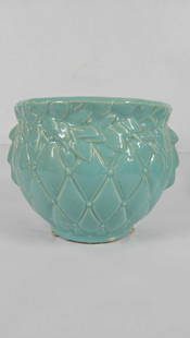 1950s McCoy Turquoise Quilted Leaf Planter: What shows like a crack on the top rim is actually from the kiln. This piece is in good solid condition. 7.5x9