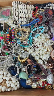Floral Brooches, Large Statement Necklaces, and Bracelets: Shell jewelry, beaded, and more. This lot of jewelry has not been thoroughly checked out and may contain gold or silver items.