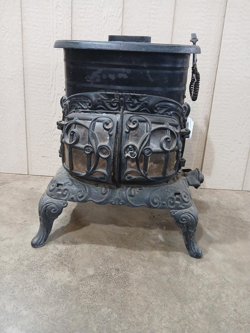Economy Stove Co Cast Iron Gas Stove: Ornate cast iron body and legs. Plastic type doors. Missing one plate. Pat 1902 made in Cleveland Ohio. 24x18x11