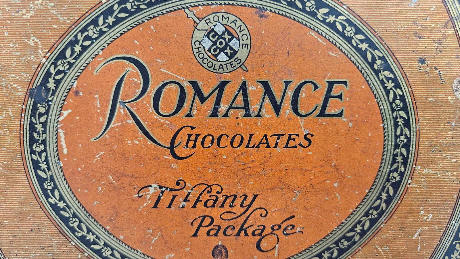 Romance Chocolates Tin: Early chocolates tin with ivory trim. Several minor scratches, but overall good condition. 7.5x5x2