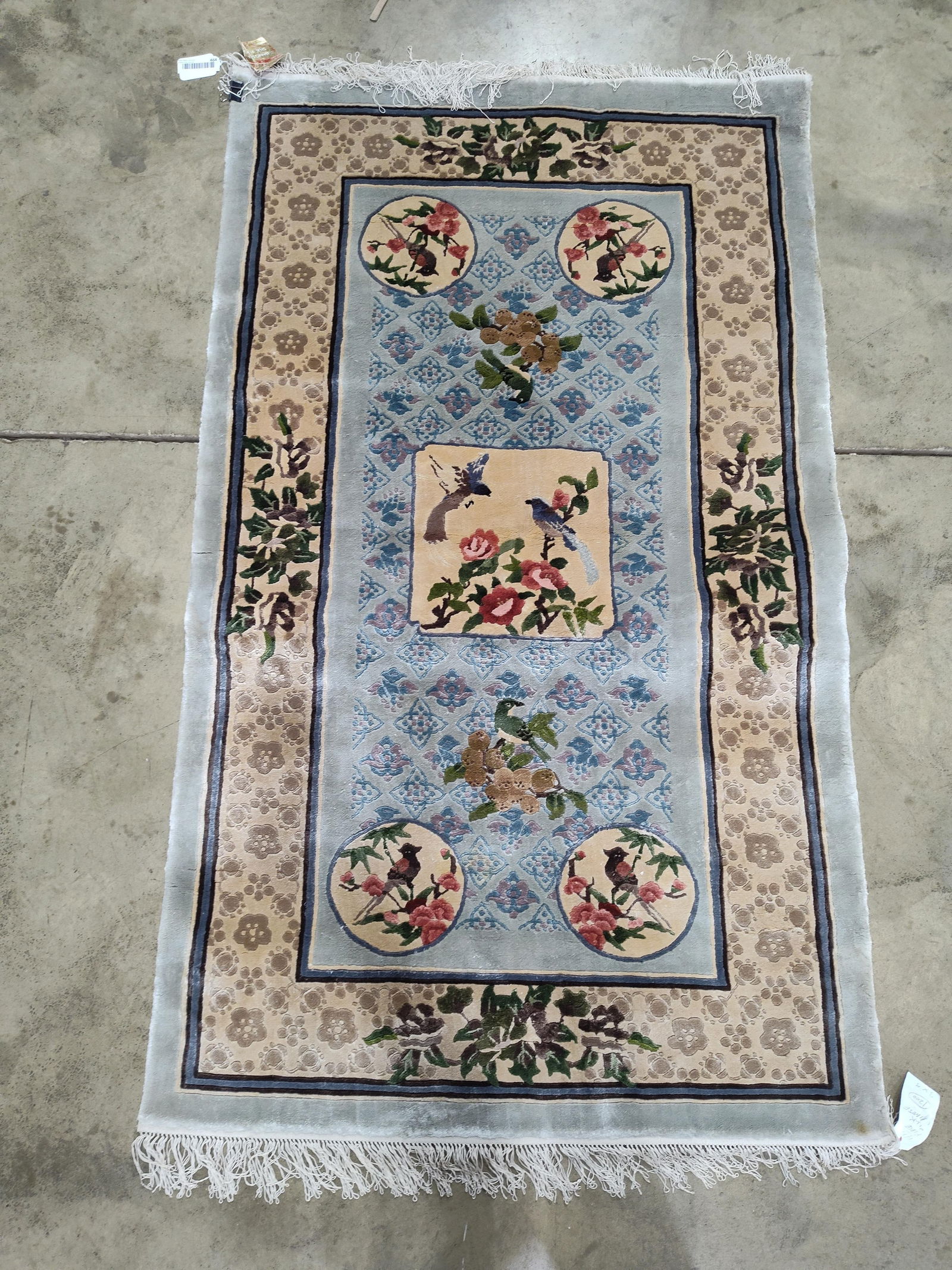 Jiangsu Silk Rug: 100% silk pile, with floral and bird design. Clean condition. 61x36.