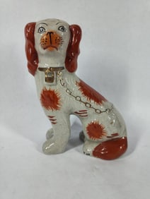 Staffordshire seated red spaniel figural statue