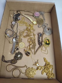 Lot of gold tone jewelry inc. watches, necklaces, pins and more