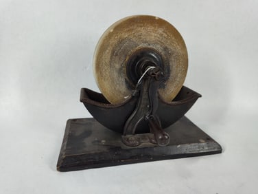 Hand crank mounted grinding wheel