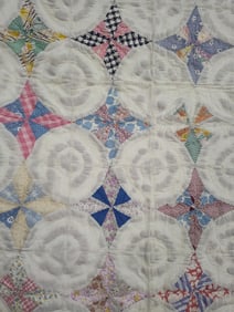 Hand stitched pin wheel feed sack quilt