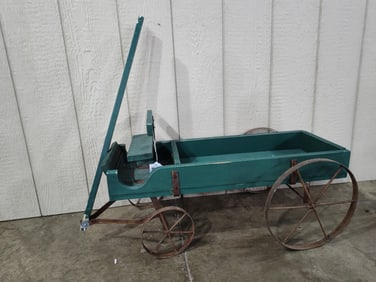 Child's primitive green painted steel wheel handle steering wagon