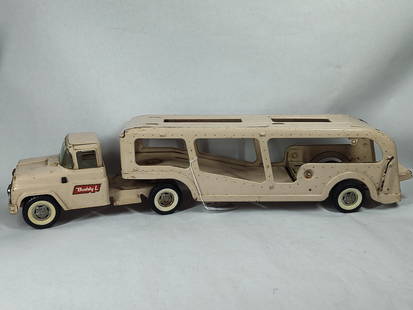 Buddy L pressed steel transporter tractor and trailer: Showing areas of rusting with all parts moving freely as should 28L