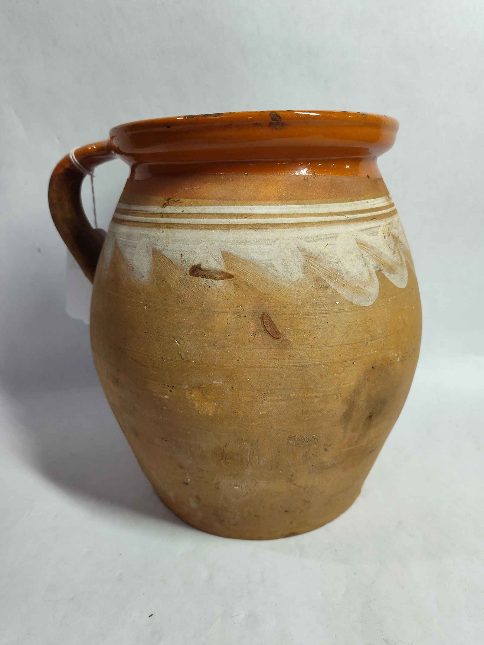 Unglazed handled stoneware jam jar: showing no chips, cracks or breaks nine inches high
