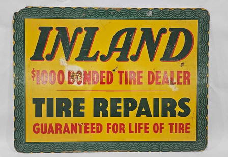Inland Rubber Tire Sign: Composite sign. Several small dents and faded spots. Upper left hand corner is chipped but color is great! 24x18