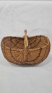 Excellent Rounded Bottom Basket: Very nice basket with twisted vine handle and tight weave. 17x13x13