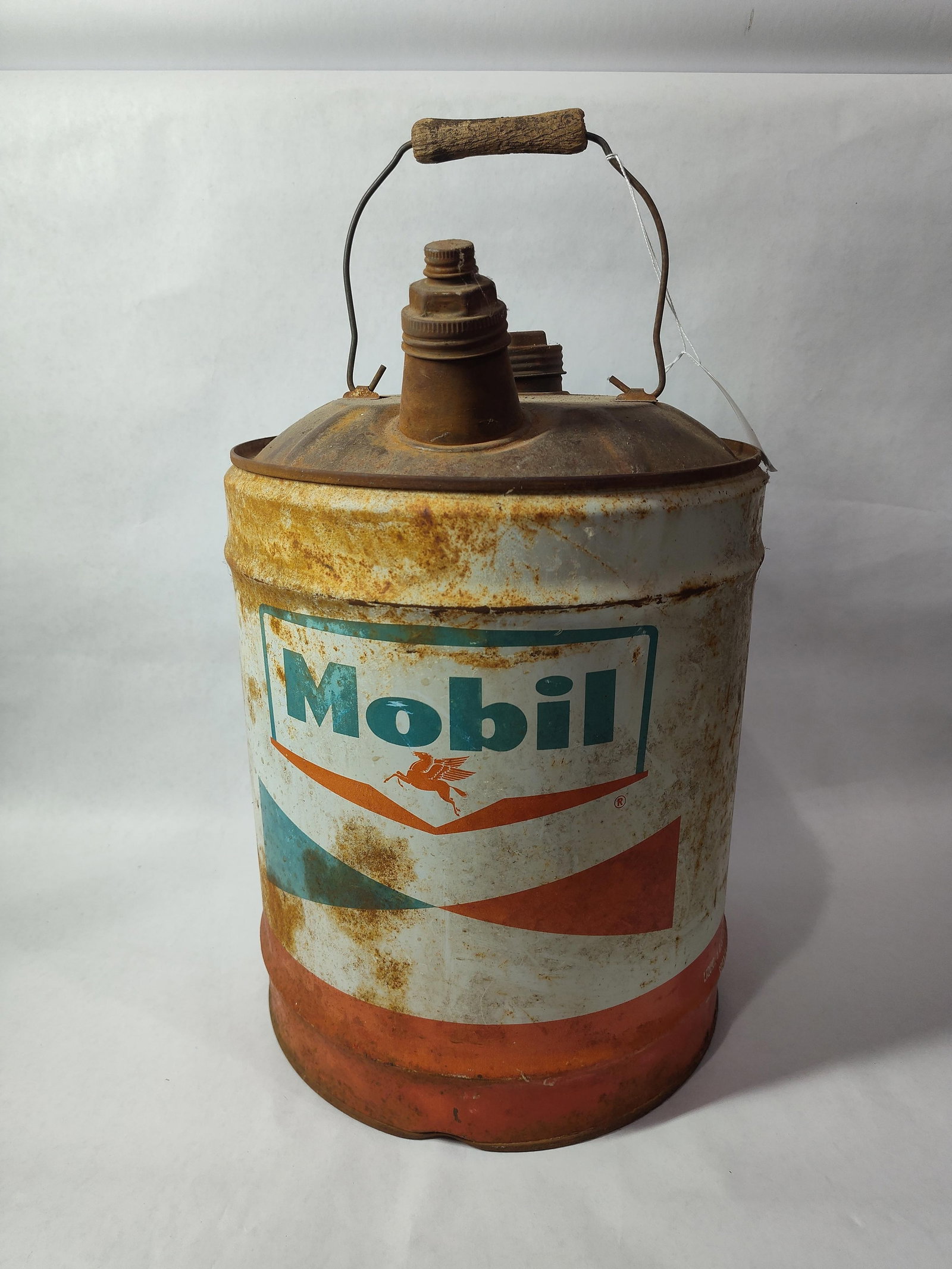 Mobil Oil 5 Gallon Can: One side shows some fading, surface rusting throughout but can is solid. 17 inches tall