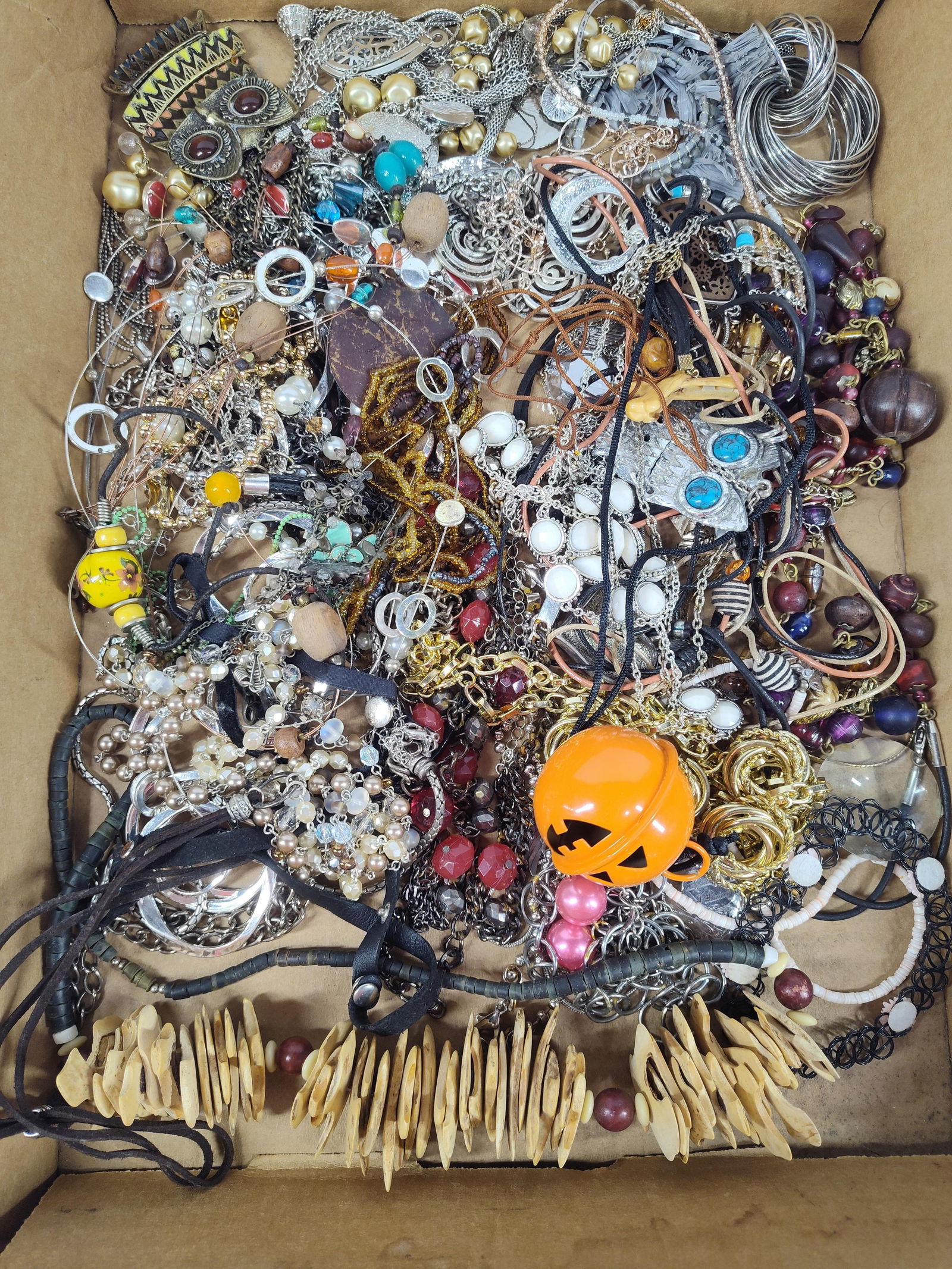 Chains, Wooden Necklace, & Beaded Jewelry: A great variety of costume jewelry.