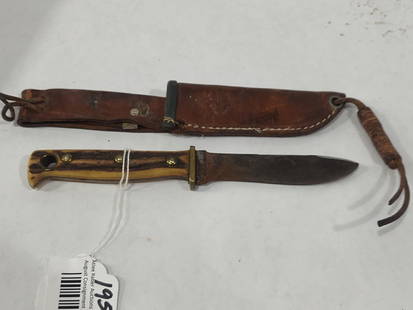 Puma German Fixed Blade Knife: Horn handle with leather sheath. Blade is rusty but could be cleaned. 3.5 inch blade with a 4 inch handle.