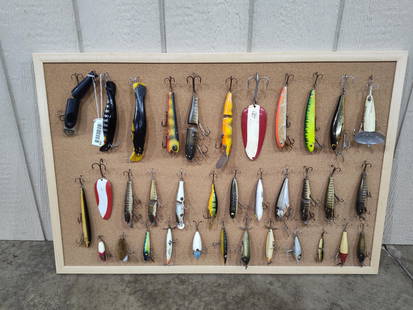 Muskie & Early Fishing Lure Collection: So many very nice lures are included in this display. Wooden lures, glass eye lures, vintage and collector pieces. Includes a Huske Devel, Homer Le Blanc, Drifter Tackle Co, Lucky Strike, and many mor