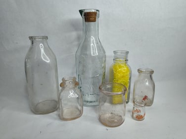 7 assorted glass milk bottles