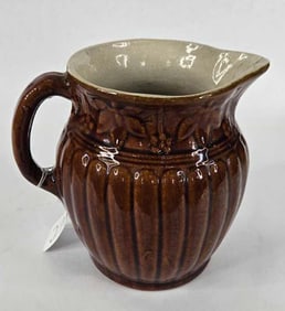 Brown salt glazed stoneware pitcher