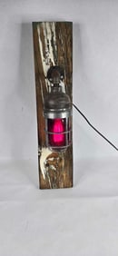 Appleton form 100 red globed elec. Nautical lamp mounted on wooden board