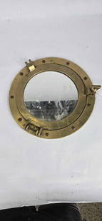 Brass Nautical porthole window mirror: 11 in in dia 1 latch is missing
