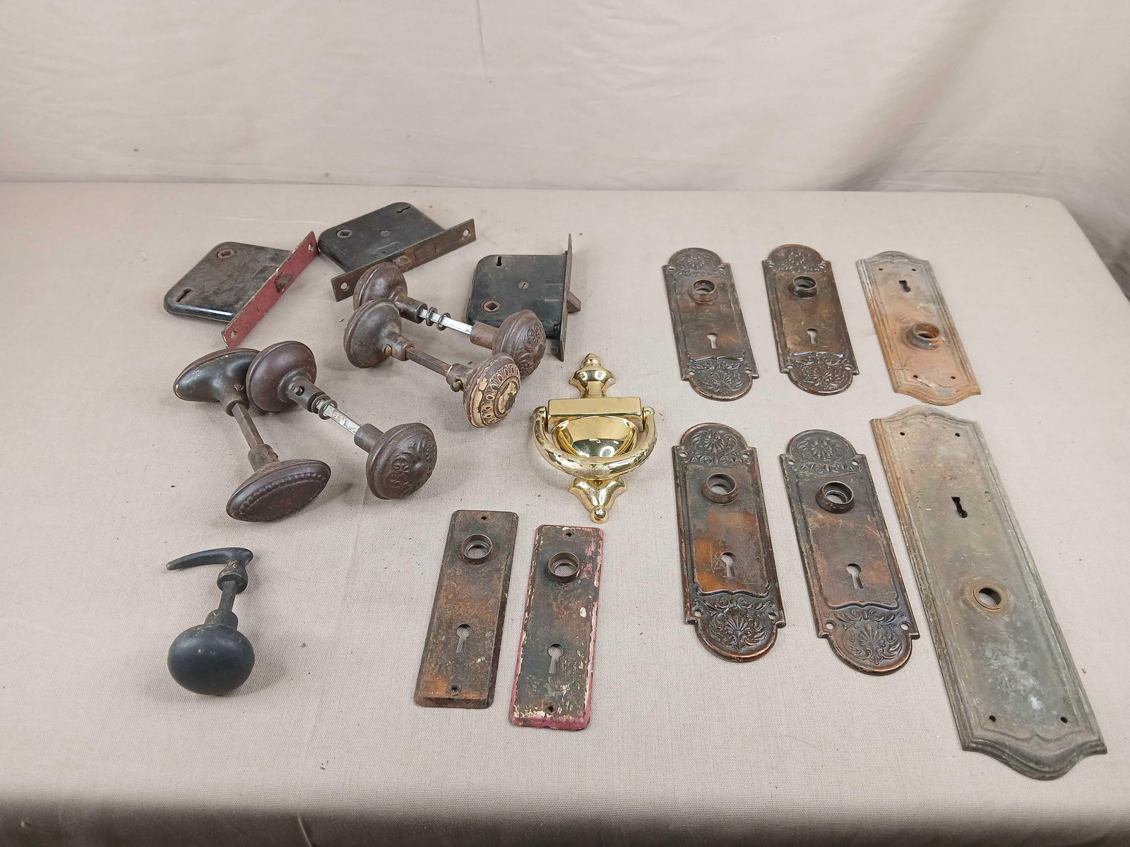 Antique door knobs ,back plate and brass door knocker: .