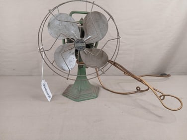 Green Kool Rite electric fan with cast iron base