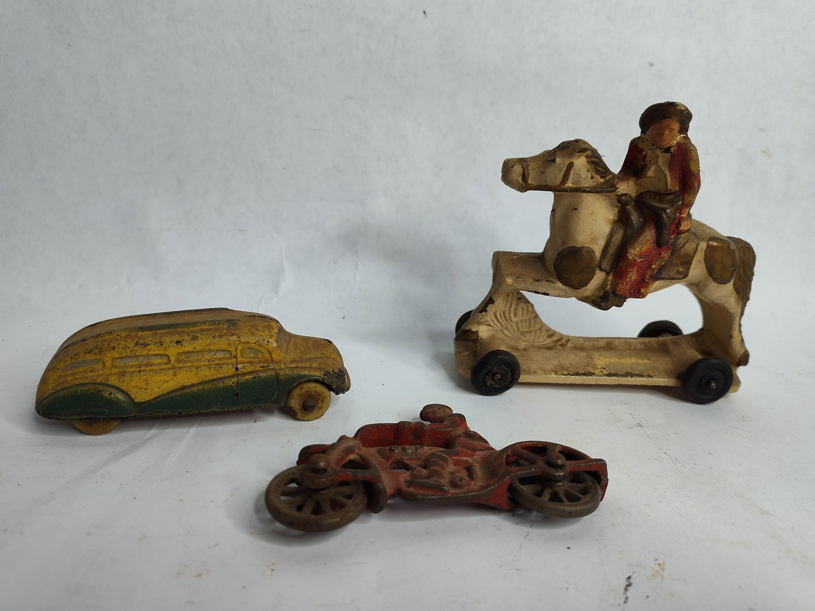 Arco hard rubber horse with rider,1930th sun rubber co car and cast iron cop on motorcycle toy: .