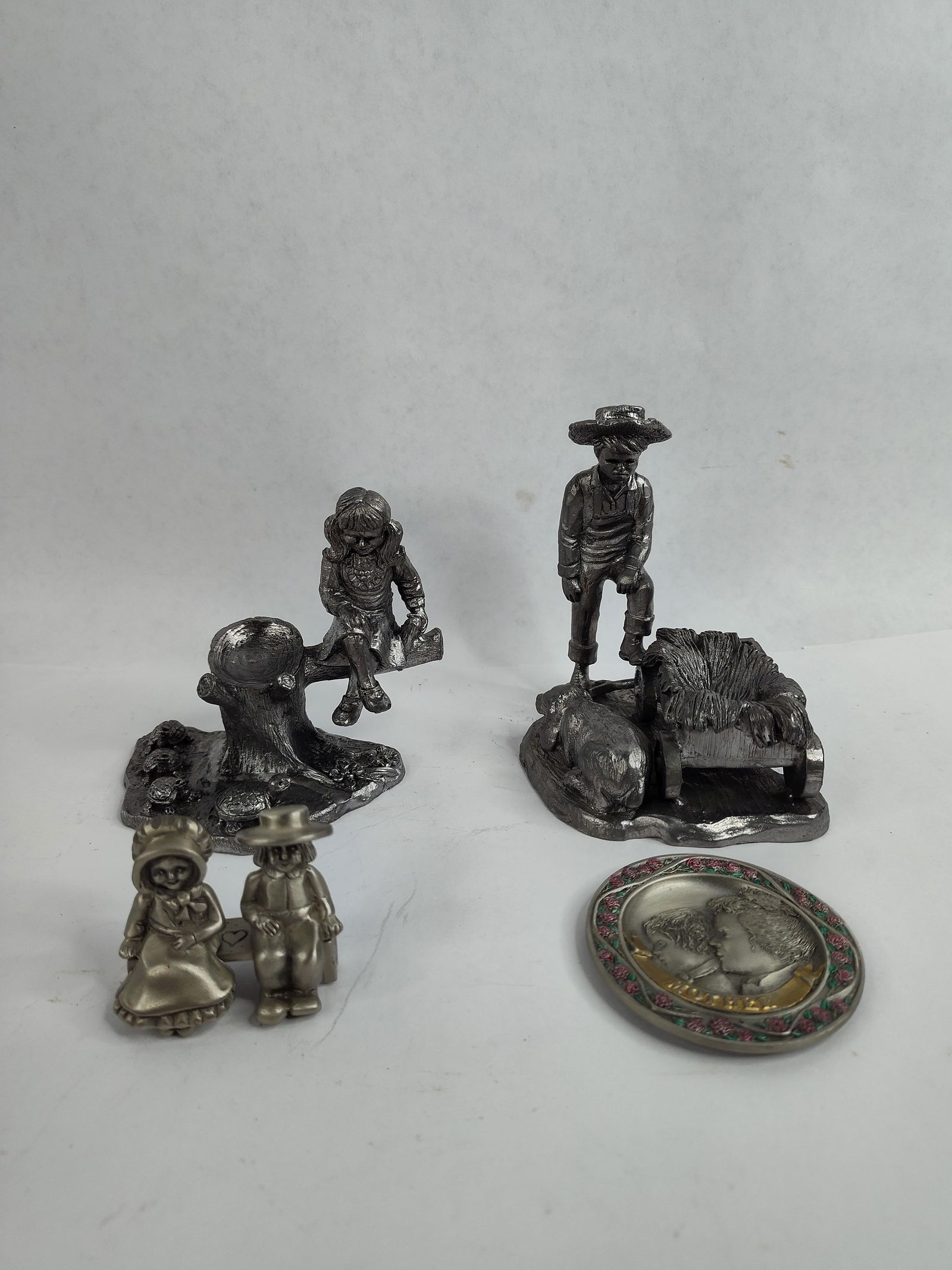 M.A.Ricker pewter farm boy with dog,girl with turtles,amish couple on bench and mother plate: all are made with pewter largest is 4.5in tall plate is 2.5 in in dia.