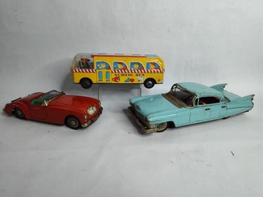 Tin friction school bus ,cadillac and red toy cars