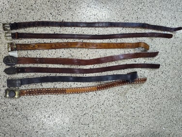7 brown leather belts and belt buckles