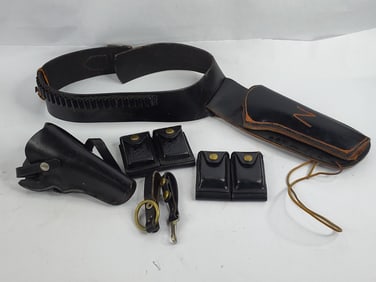 Black leather hunter cartridge belt , pistol holsters and double dump ammo holsters