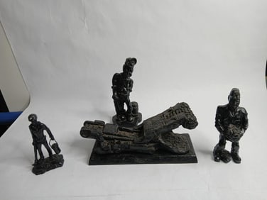 Hand carved coal miners and machine from coal