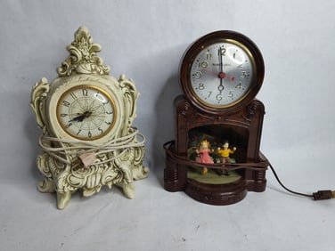 Holland mold Lanshire cherubs mantle clock and Master crafters lighted children swinging clock