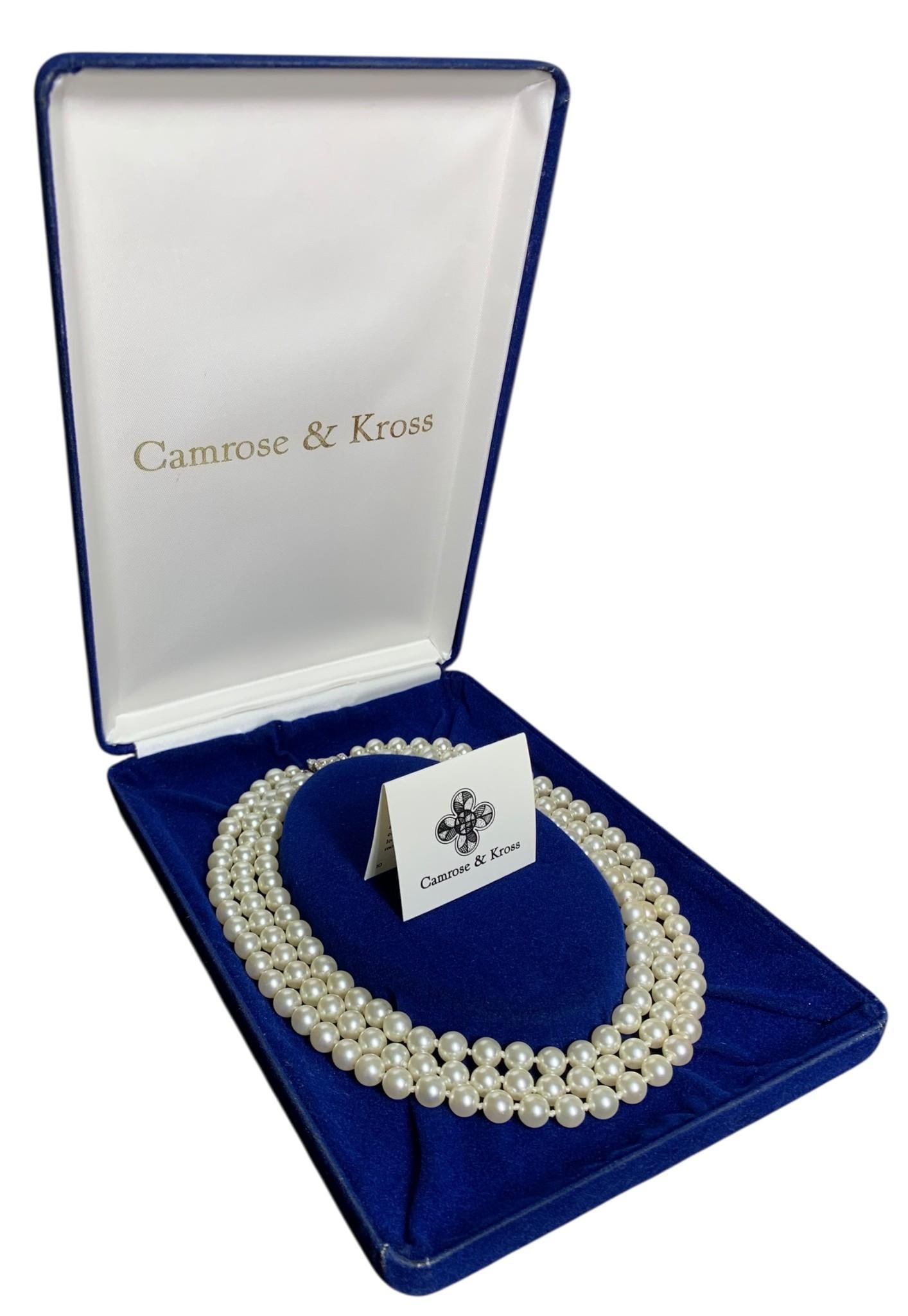 Stunning Camrose & Kross Jacqueline Kennedy Inspired Triple Strand European Faux Pearl Necklace: Complete with velveteen storage case and pair of Camrose & Kross&;booklets - noting these faux pearls are crafted of glass&;with Swarovski&;crystal accents,&;working closure and hand tied knots, 16" c