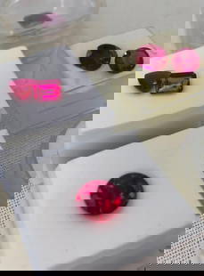 7 Large Carat Faceted Lab Created Ruby Unmounted Jewelers Gemstones: Cases shown included, some with tags on the underside, noted as 7 Carat to 1.75 Carat in size, each a rich raspberry hue in a fine assortment of shapes.