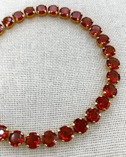 Incredible 14k Gold 23 CTW Spiced Honey Hessonite Garnet Tennis Bracelet: Hallmarked 14k, 29 prong set round 6mm (approx .80 carat per gemstone) warm spice hued Hessonite Garnet, with outstanding sparkle and depth, working closure and safety clasp, 8" wrist circumference.