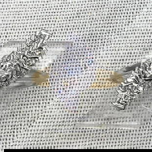 14k Gold Art Deco Sparkling 11 Diamond Spiral Tied Ribbon Promise Ring: Hallmarked 14k, approx. 4mm center Diamond with 10 petite Diamond gemstones, ribbed framework and intricate detailing, 7.5 size, one tiny edge of a diamond (set at one end of the ribbon) is nipped at