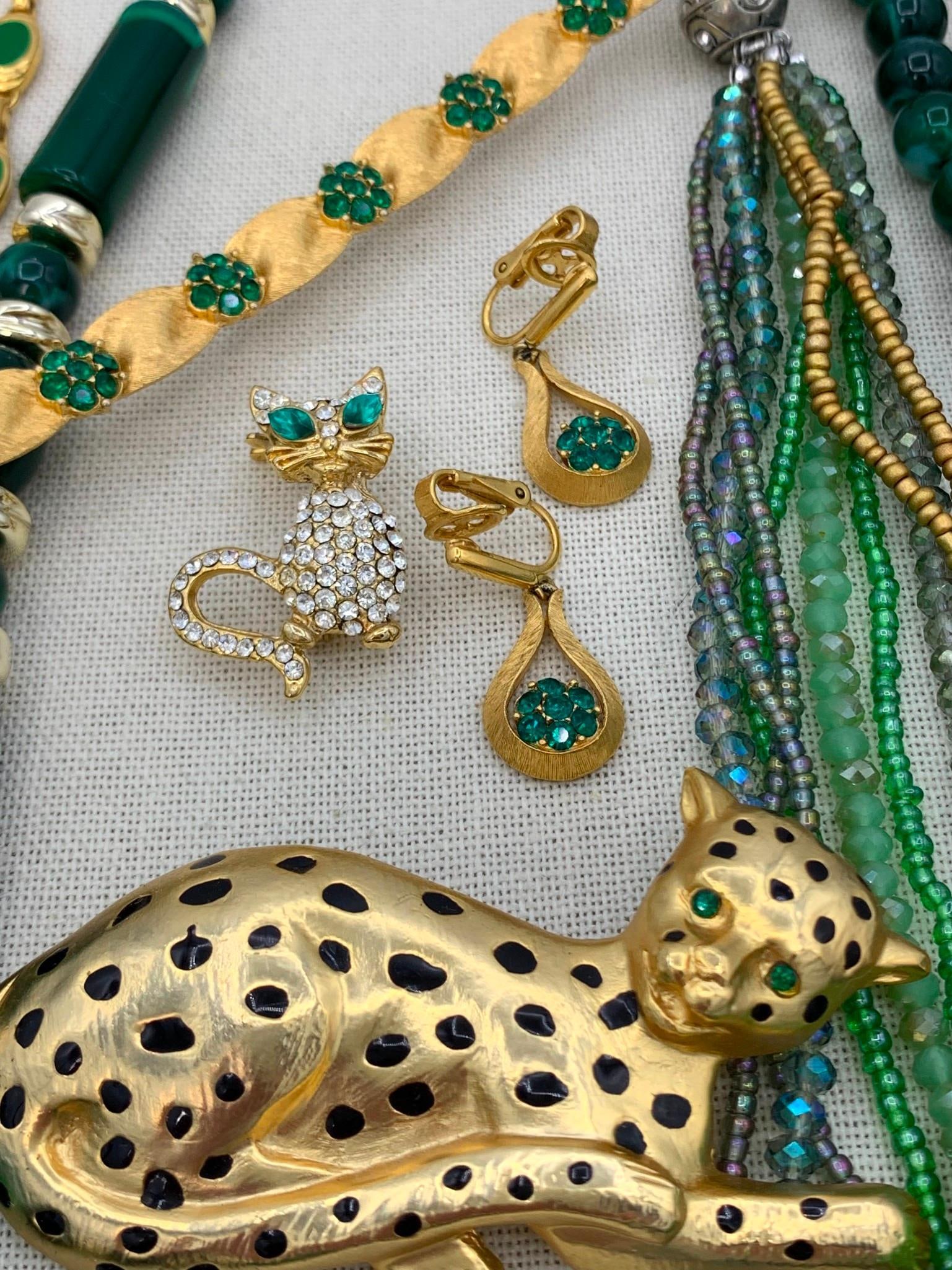 12 pc Vintage TRIFARI, Monet, Lucite Glittering Faux Emerald Big Cat Costume Jewelry Collection: Luxe assortment of adornments...including a Mid Century Trifari bracelet and clip faux emerald earrings with the Trifari jewel box, marbled Hong Kong Lucite necklace with the tag, large 3 1/4" green e