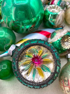 34 pc Vintage Emerald Green Blown Glass and Plastic Christmas Tree Ornaments: Including indent, sequined foam, faceted plastic, painted and glittered glass, 6 Mid century oriental lanterns in ribbed plastic and a 4 pc box of Colombian Kurt Adler glass holly decorated bulbs, one