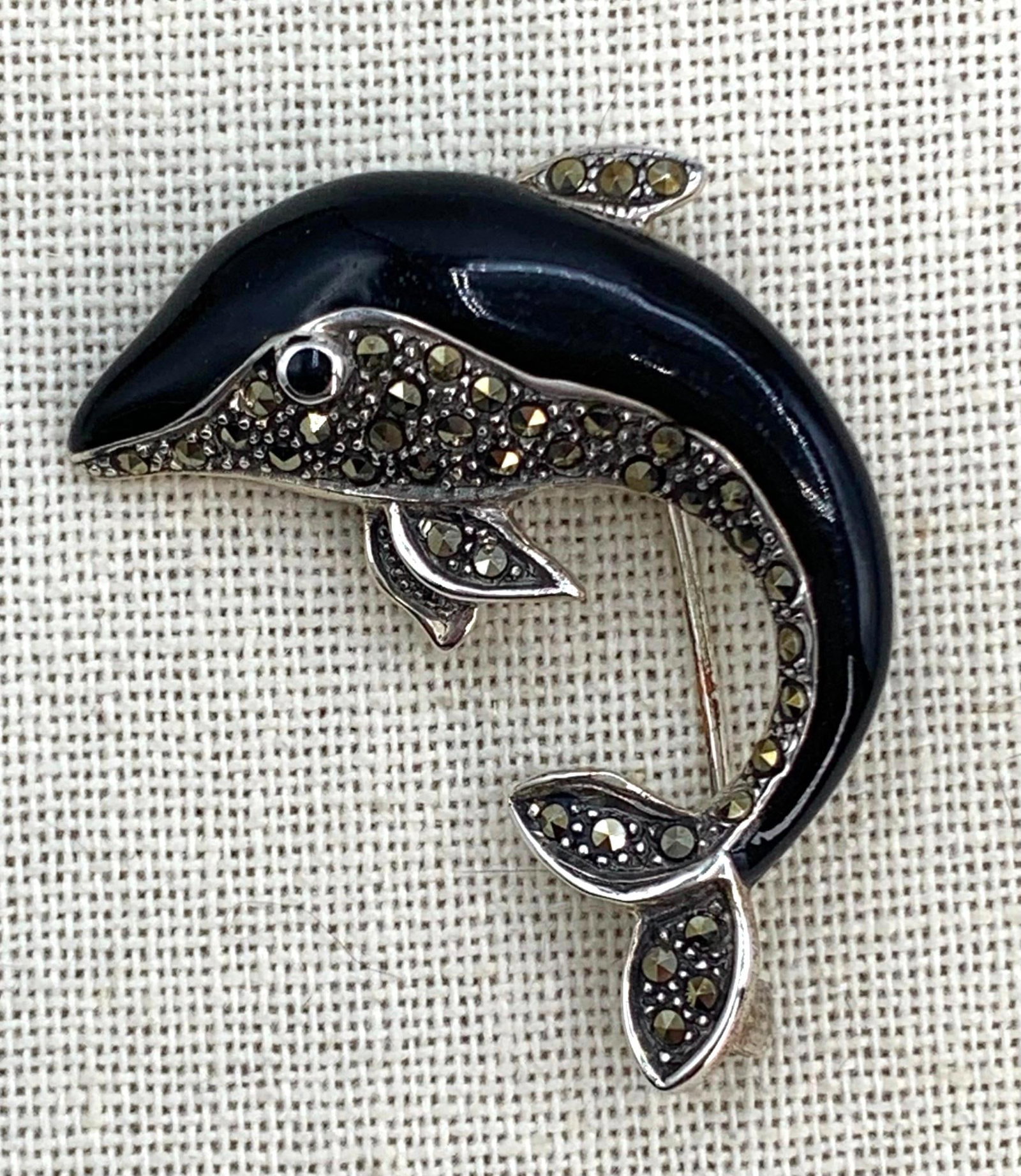Sterling Silver Glittering Marcasite Dolphin 925 Brooch: Hallmarked 925, 9.8 gram weight, working closure, 1 7/8" x 1 5/8".
