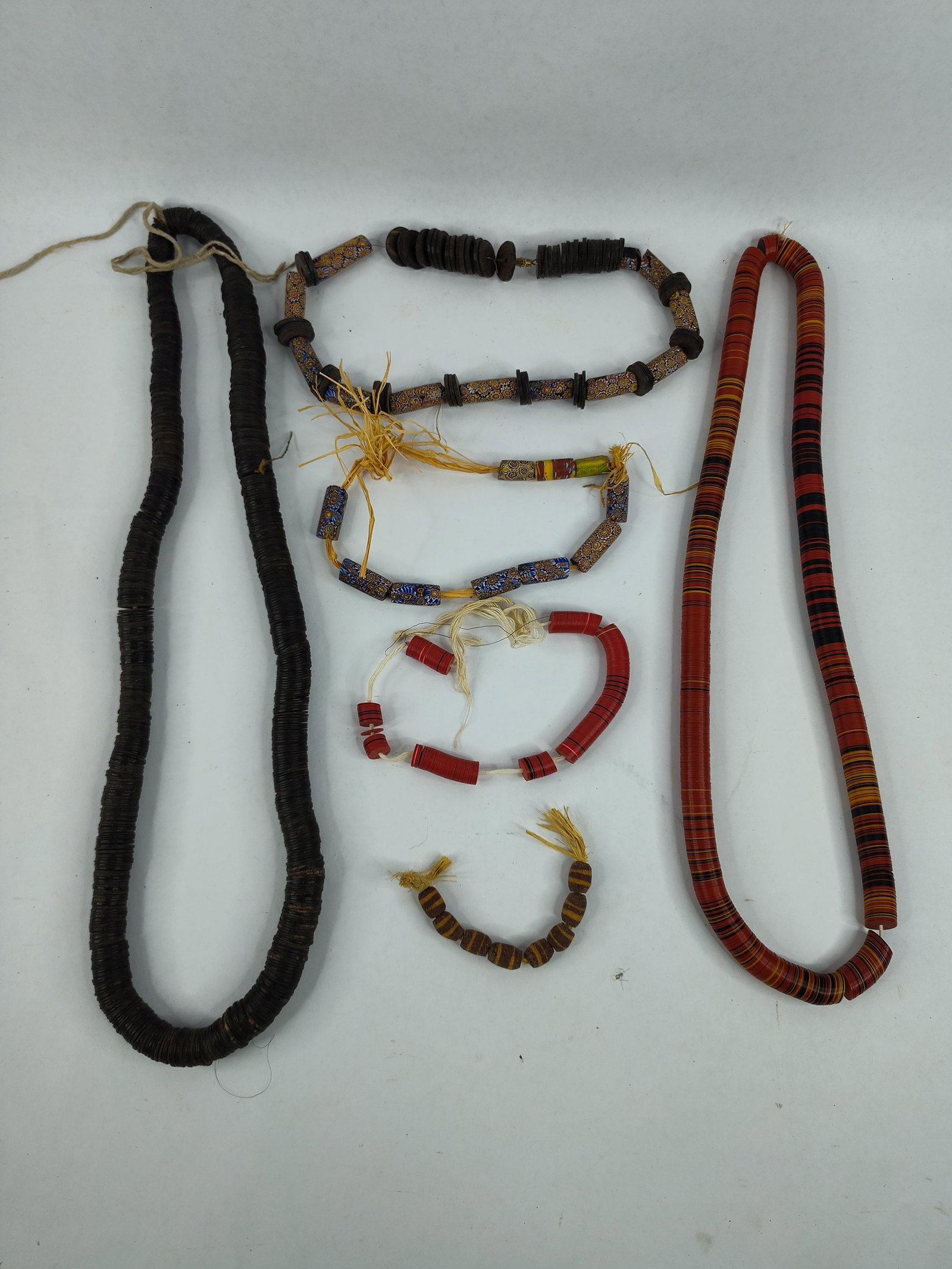 West African Venetian Millefiori trade beads, Vulcanite waist beads lot: This lot includes various cultural adornment and trade beads of assorted lengths and sizes