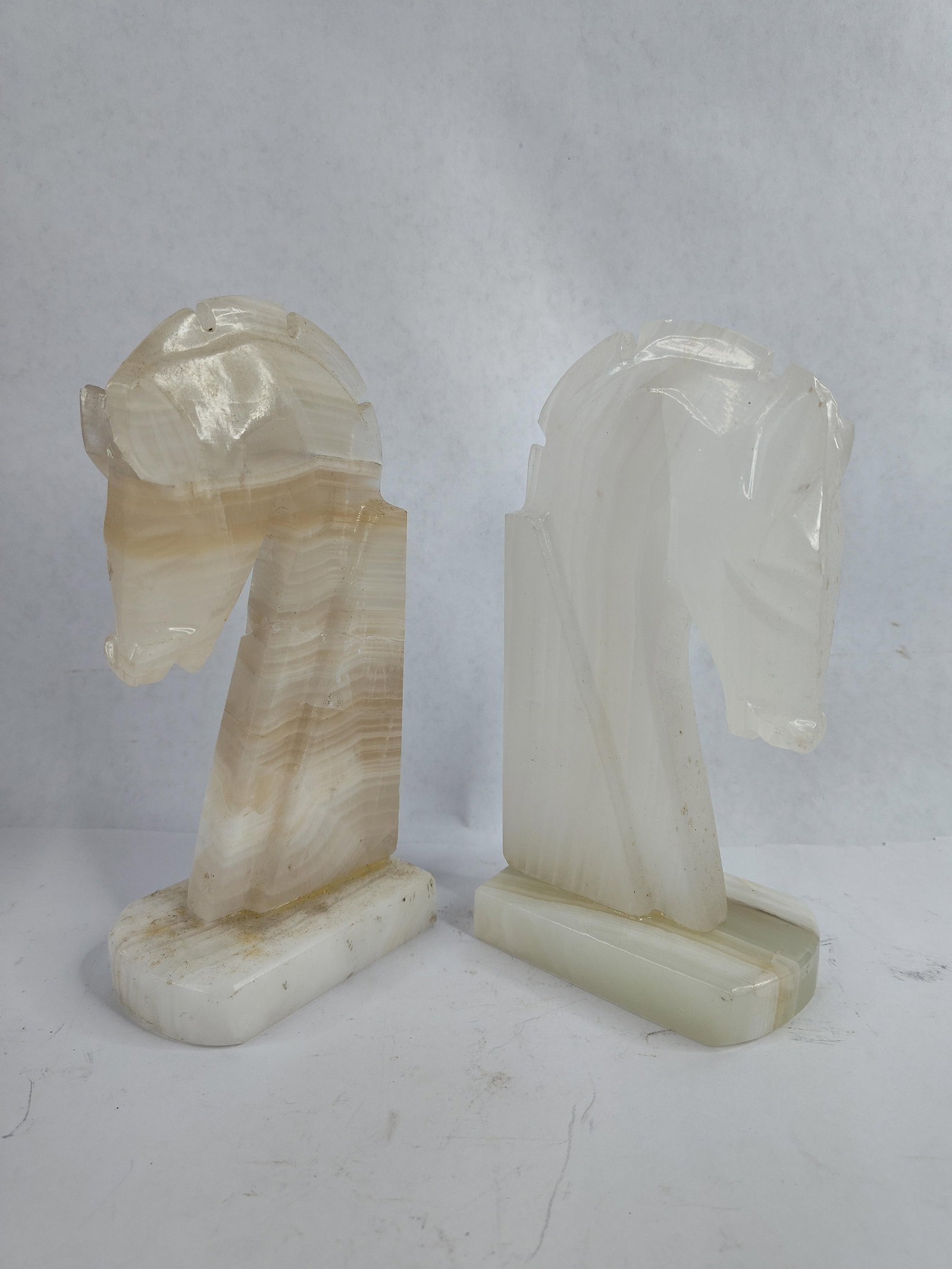 Mid Century marble/alabaster horse head bookends carved from natural stone: showing repairs to one?8 in.