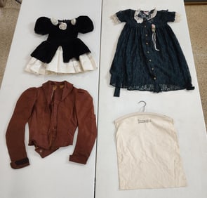Motion Picture Costume Co. hanger with vintage jacket and dresses