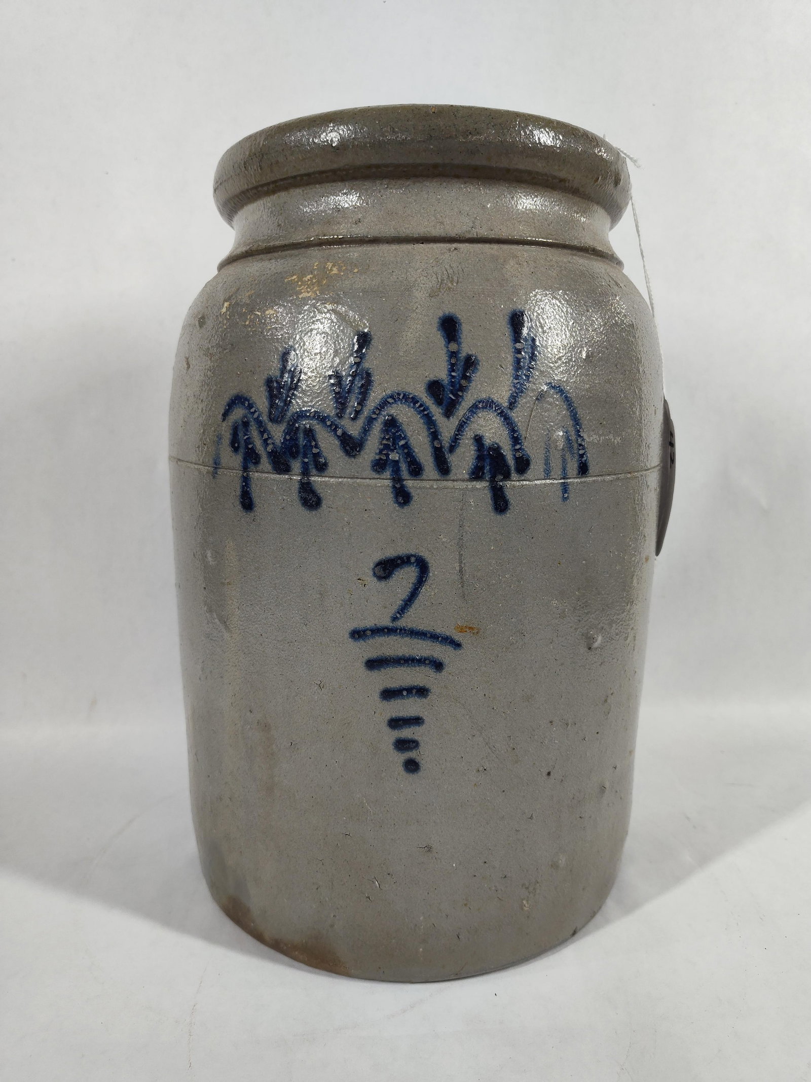 2 Gallon Decorated 1879 Crock: Unique arched and arrow design with numbers etched into glaze on back side. Date 1879 to back. Lopsided 12 in tall