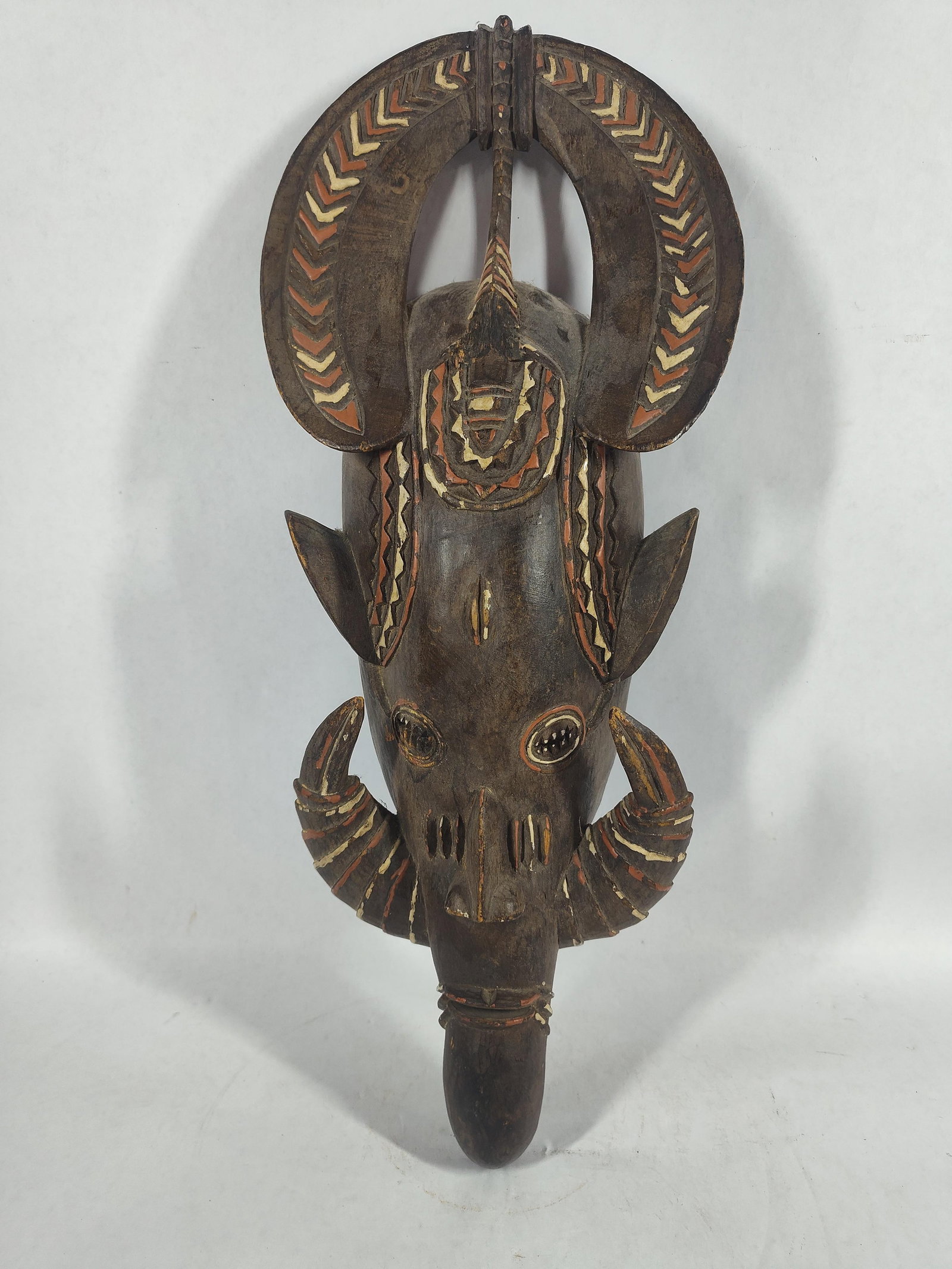 Authentic African Senufo Tribal Mask: Cote d'Ivoire. With striped detail, tusks, and ceremonial headpiece. 21 inches tall