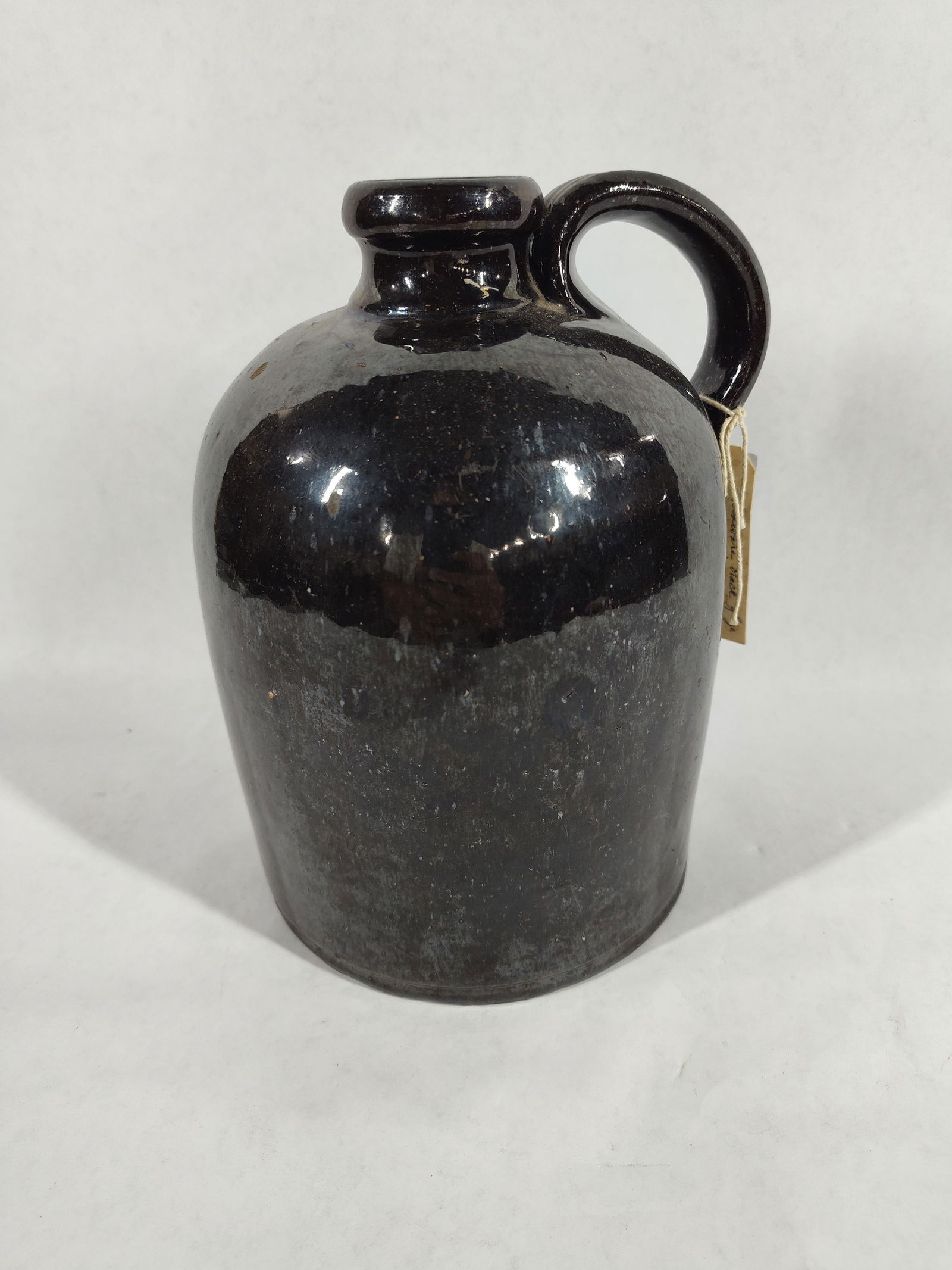 Redware Black Glazed Jug: Approx half gallon. Over all very clean condition. A few minor chips to bottom.