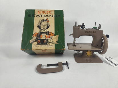The Singer Sewhandy Sewing Machine: Original box including original tag. Model no 20