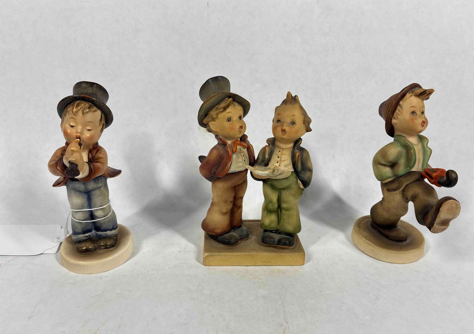 Goebel Hummels: Serenade 85/0 dated 1978, Trotter 109/0, and Duet 130- small chip to coat tail.